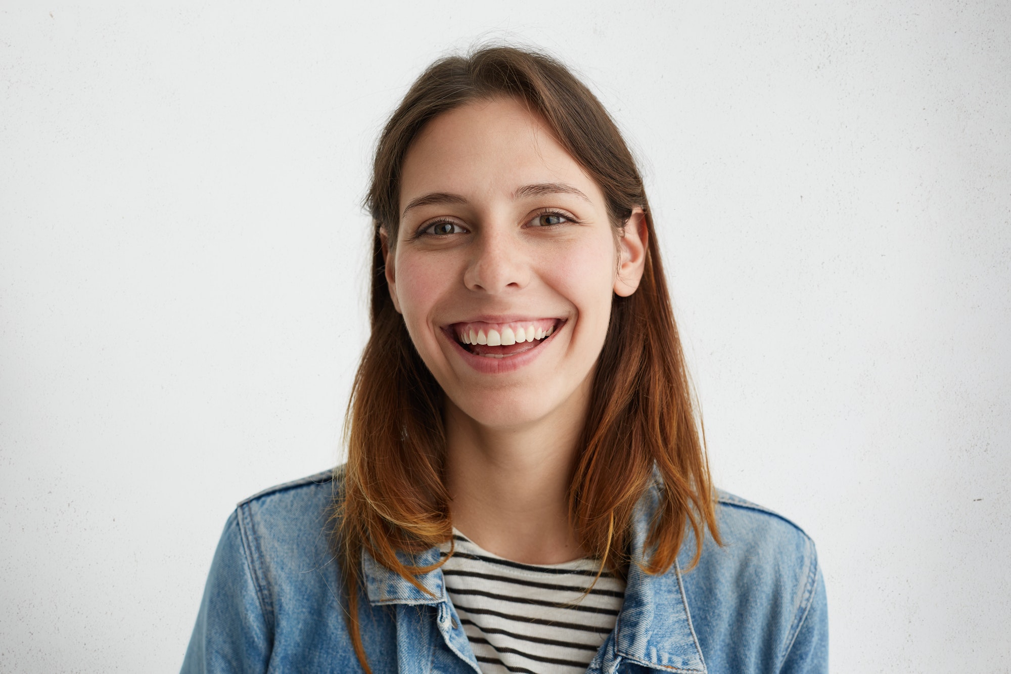 people-and-lifestyle-headshot-of-attractive-charming-young-woman-with-dark-hair-looking-and-smiling.jpg